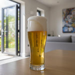 Glass of beer on a table with a blurred background