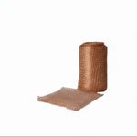Rolled-up copper mesh on a white background