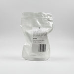 White powder in a clear plastic bag with a label on a white background