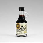 Mini bottle of Connemara Irish Whiskey spirit flavour on a gray background