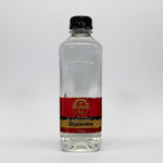 Bottle of glycerine with a red label on a white background