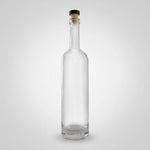 Clear glass bottle with cork stopper on a white background