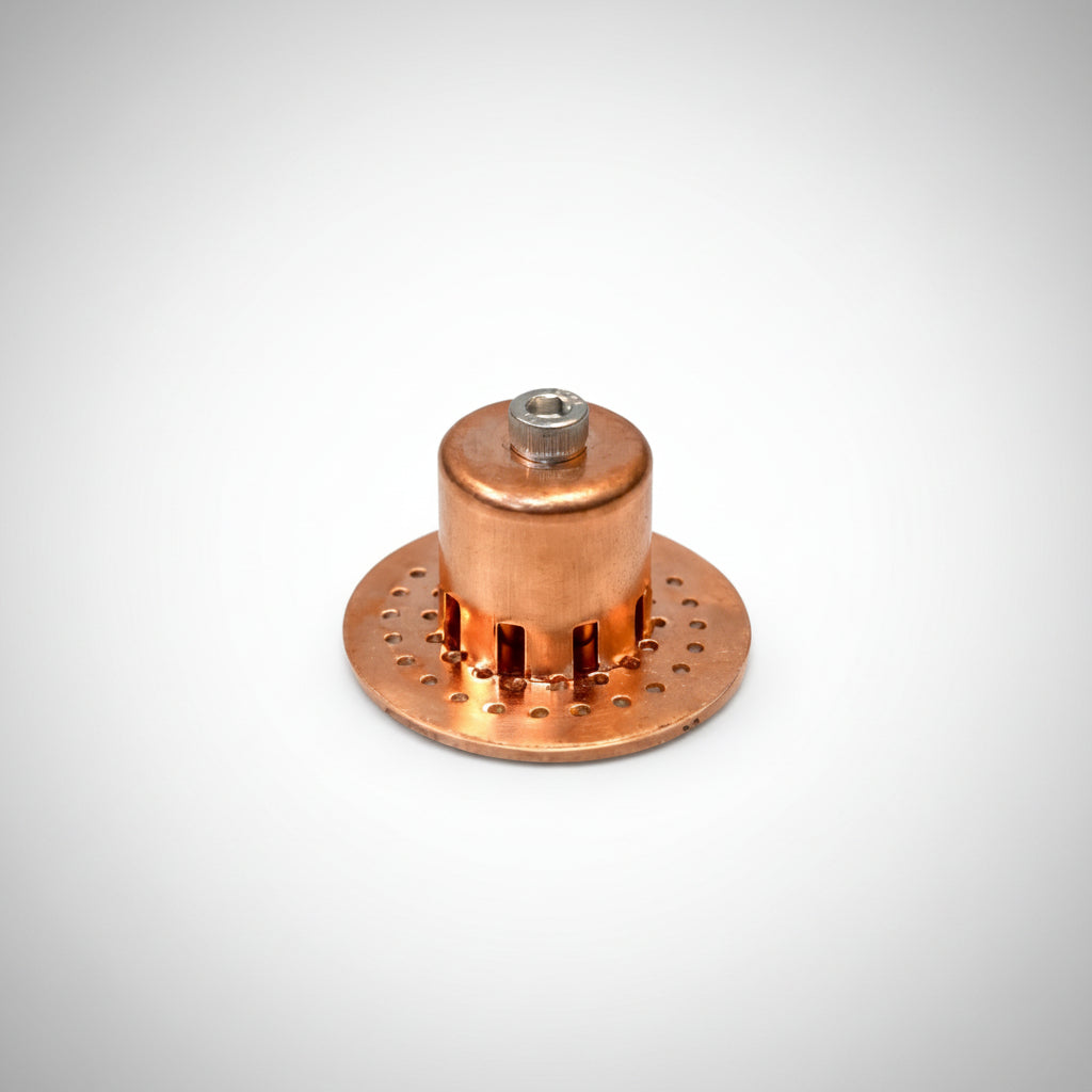 Copper metal bubble plate with threaded fitting on a white background